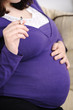 pregnant woman smoking a cigarette