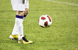 Soccer player running after the ball