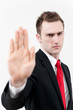 young businessman showing stop gesture