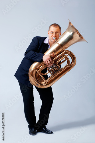 Photo: Man is Playing on a Big Tube. Man is Playing on a Big Tube.