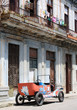 Tattered old open top car in a typical street of Havana, Cuba Tattered old open top car in a typical street of Havana, Cuba