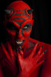 Evil red devil woman. Low key lighting.