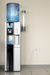Office cooler and cup of water