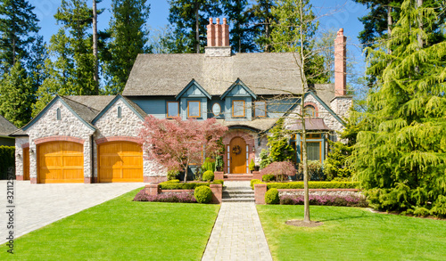 Photo: Luxury house at sunny day in Vancouver, Canada. Luxury house at sunny day in Vancouver, Canada.