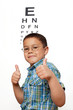 Little Boy Happy with Glasses at Optometrist's Office