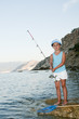 Fishing -  girl fishing at the beach
