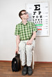 person wearing spectacles in an office at the doctor
