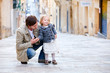 Father and daughter in city