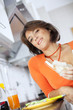 beautiful woman eating breakfastl (shallow DOF)