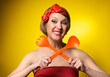 Pinup style housewife with kitchen utensils
