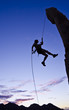Rock climber rappelling.