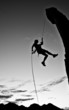 Rock climber rappelling.