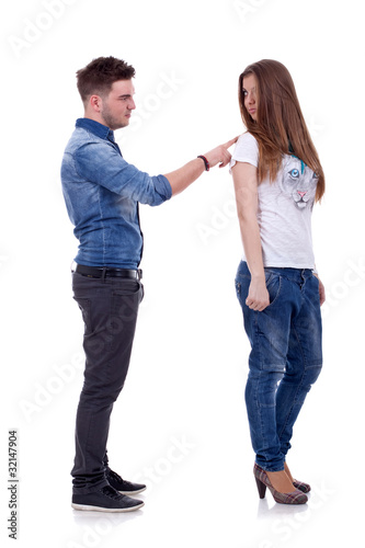 Photo: young man pokeing his girlfriend young man pokeing his girlfriend