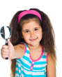 little girl looking through a magnifier