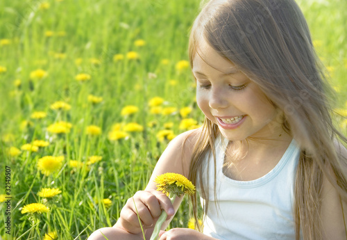 Photo: Little girl with dandelion Little girl with dandelion