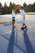 Foto: Doubles Tennis Players On A Court Doubles Tennis Players On A Court