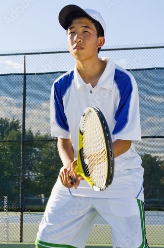 Photo: Tennis Player Alone On A Court Tennis Player Alone On A Court