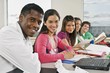 Students In A Classroom With A Laptop
