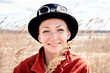 Happy woman wearing danger style glasses in reed