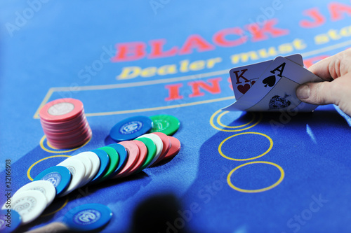 Photo: woman play black jack card game in casino woman play black jack card game in casino