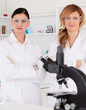 Two female scientists posing