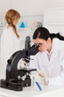 Two female scientists conducting an experiment