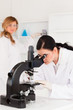 Two female scientists carrying out an experiment