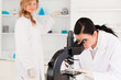 Two scientists carrying out an experiment