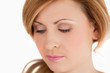 Isolated blond-haired woman looking at the camera