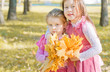 Foto: two girls in autumn park two girls in autumn park
