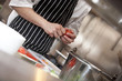 Commis Chef peeling tomato