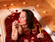 Woman relaxing in bath.