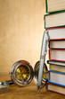 pile of books and pens on wood