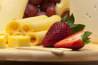 Photo: A set of different cheeses, strawberry and grapes A set of different cheeses, strawberry and grapes