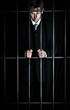 Businessman behind bars