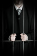 Businessman in prison cell