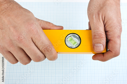 Photo: Building tool in the hands Building tool in the hands