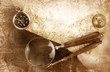 Compass and magnifier on textured paper