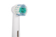Electric toothbrush head close up on white background.