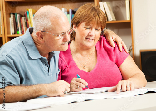 Photo: Mature Couple Studies in Library Mature Couple Studies in Library