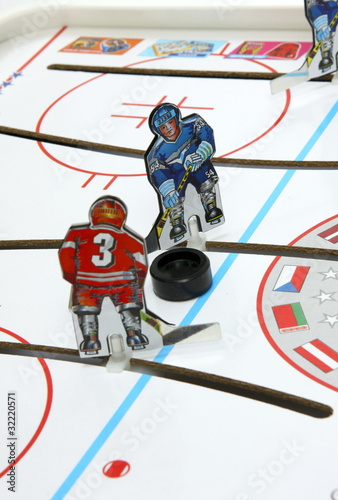 Photo: Hockey players duel. Hockey players duel.