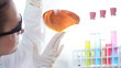 Video: Female scientist mixing chemicals in volumetric flask Female scientist mixing chemicals in volumetric flask