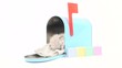 Cute baby kitten taking a nap inside of blue mailbox