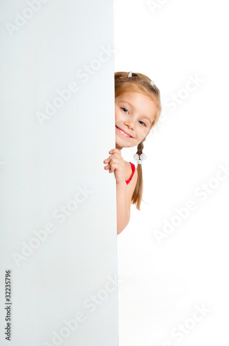 Photo: girle beside a white blank girle beside a white blank