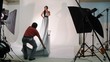 model in long dress pose for photographer in studio, time lapse