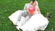 Newlywed pair sit with heart balloon and little doggie Newlywed pair sit with heart balloon and little doggie