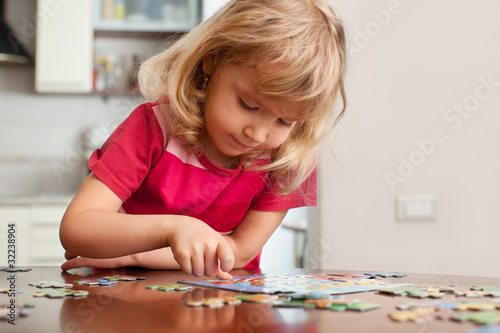 Photo: Girl, playing puzzles Girl, playing puzzles