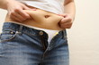 Woman measuring fat