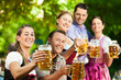 In Beer garden - friends drinking beer