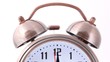 close-up shot of ringing alarm bell clock on white